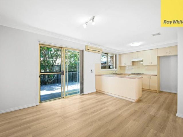 SUN FILLED TWO BEDROOM TOWNHOUSE LOCATED IN QUIET LEAFY BLOCK