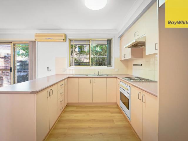SUN FILLED TWO BEDROOM TOWNHOUSE LOCATED IN QUIET LEAFY BLOCK
