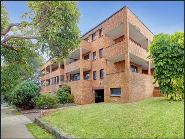 SUN FILLED TWO BEDROOM UNIT WITH LEAFY OUTLOOK!