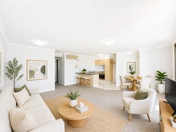 SUN FILLED 2 BED, 2 BATH RETREAT STEPS FROM THE BROADWATER