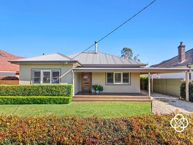 Sun soaked style and family living in one of Kotara's most desirable streets