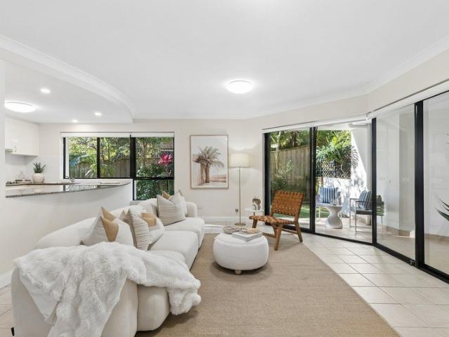 Sunlit garden apartment in a boutique coastal setting