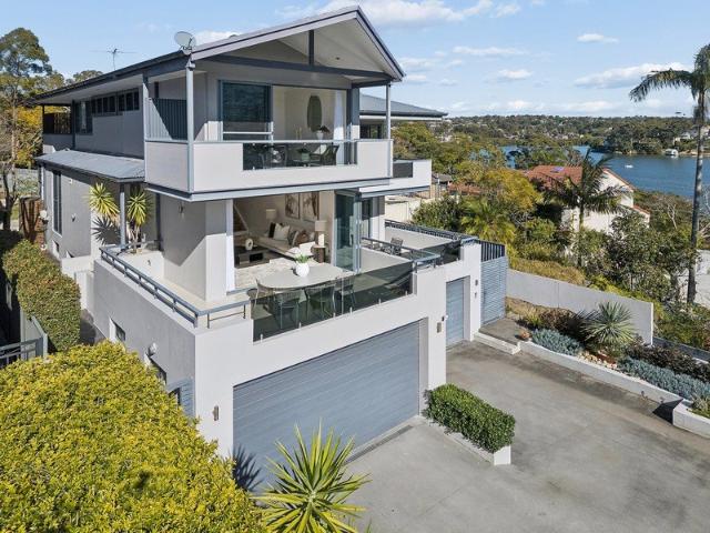 Sunlit family haven overlooking the glistening bay