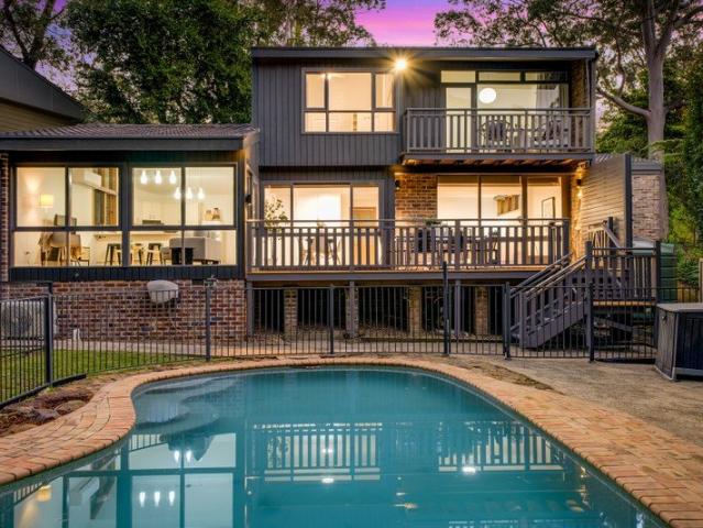 Sunlit Family Living with a Bushland Backdrop