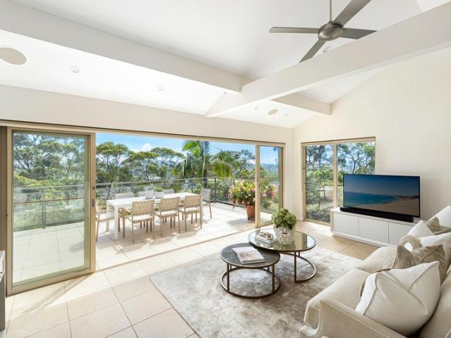 Sunlit family retreat with panoramic ocean vistas