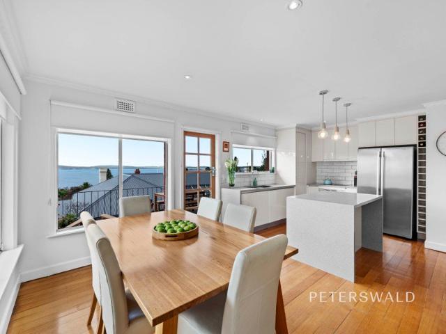 Sunlit living with water views