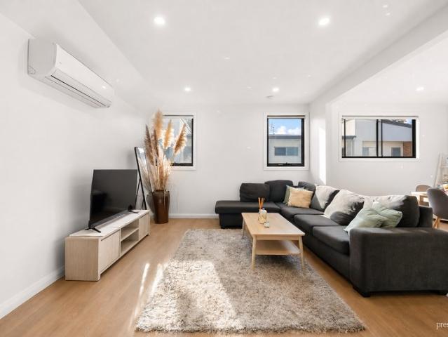 Sunlit Townhome Offers Flexibility & Privacy in a Prime Connected Location
