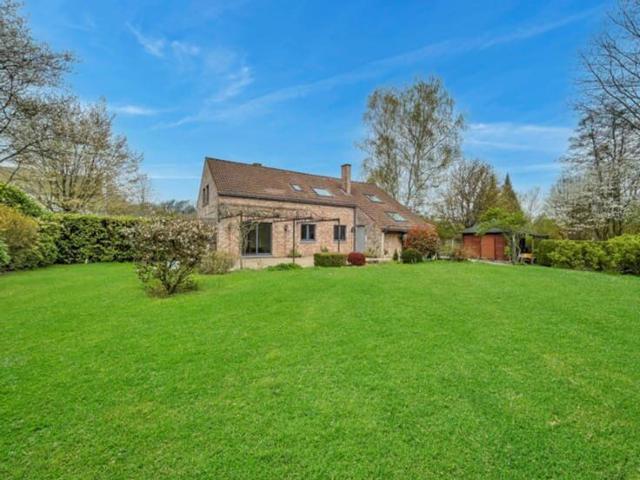 Sunlit villa in the verdant heart of Lasne