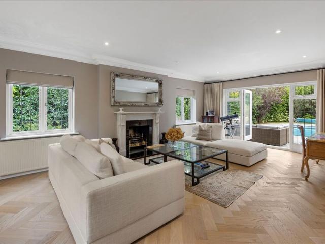 Substantial five bedroom family home on a mature secluded plot with south facing garden