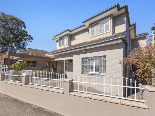 Substantial home with two self contained levels and prime convenience