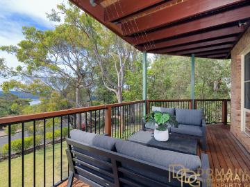 Substantial North Facing Family Home with District & Water Views