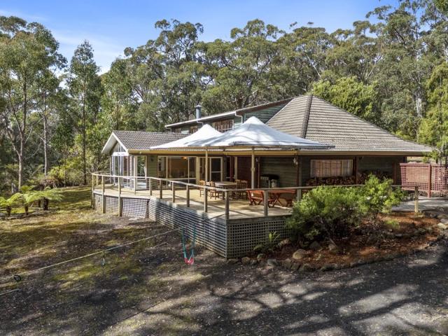 Substantial Residence and outbuildings on large waterfront acreage