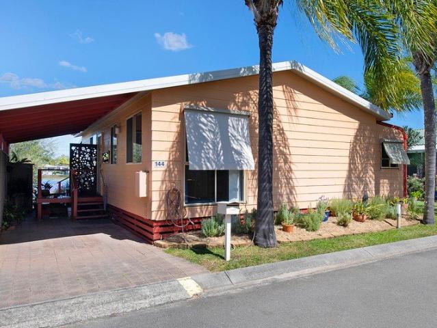 This Character Home in Paradise Lake Over 50's Park has Open Verandah Overlooking Wide Water Views of the Lake. Needs to Sell!