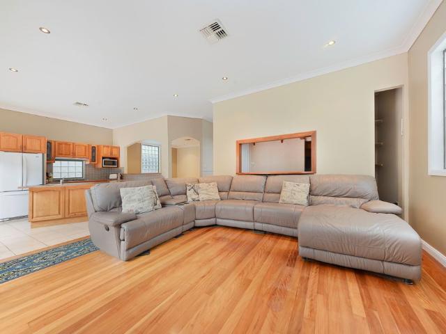 Superb Coastal Family Haven With A Spacious Dual Level Layout & Pool