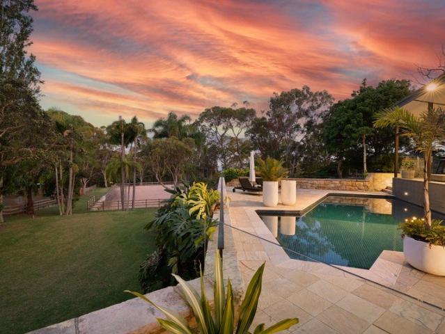 Superbly designed trophy acreage estate with superb equine facilities and dreamy leafy filtered ocean vistas